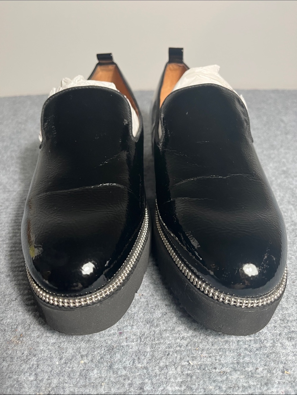 Franco Sarto Patent Slip-On Loafers with Silver Trim. Notable creasing on top.